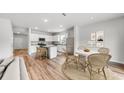 Open-concept kitchen and dining area with a center island, stainless steel appliances, and natural light at 725 Meadowbrook Ln, Summerville, SC 29486