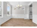 Dining room featuring wood floors, ample natural light, and decorative trim at 735 Maynard Ln, Summerville, SC 29486