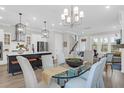 Open-concept dining area and kitchen with lots of natural light and elegant decor at 779 Forrest Dr, Charleston, SC 29492