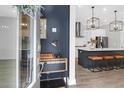 Modern kitchen with stainless steel appliances, stylish lighting, and center island with seating at 779 Forrest Dr, Charleston, SC 29492
