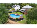 Inviting backyard oasis with a sparkling pool, lounge chairs, and well-maintained landscaping at 910 Kushiwah Creek Ct, Charleston, SC 29412