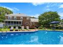 Lovely in-ground pool with patio furniture and a spacious deck for outdoor entertaining and relaxation at 910 Kushiwah Creek Ct, Charleston, SC 29412