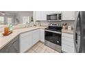Bright kitchen features stainless steel appliances and light countertops at 1012 Basildon Rd, Mount Pleasant, SC 29466