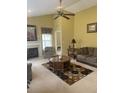 Bright living room boasts high ceilings, a fireplace, and a stylish rug, creating a comfortable space at 103 Savannah River Dr, Summerville, SC 29485