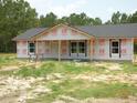 Exterior view of home under construction with visible framework and Grip Rite house wrap at 1219 Pineville Cir, Pineville, SC 29468