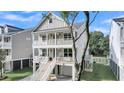 Inviting two-story home featuring a double balcony and staircase at 1304 Lieben Rd, Mount Pleasant, SC 29466
