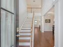 Bright foyer with hardwood floors, staircase, and high ceilings welcomes you into this lovely home at 143 Airy Dr, Summerville, SC 29486