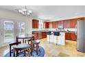 Eat-in kitchen area featuring dark cabinetry, stainless appliances, and a breakfast bar at 145 Woodbrook Way, Moncks Corner, SC 29461