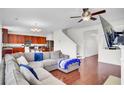 Open-concept living room features dark wood floors and a comfortable sectional couch at 145 Woodbrook Way, Moncks Corner, SC 29461