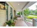 Charming front porch with ample space, stylish decor, and great curb appeal at 1511 Fairway Dr, Charleston, SC 29412