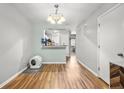 Bright dining area featuring hardwood floors and an open view to the kitchen at 1530 Fort Johnson Rd # 1L, Charleston, SC 29412