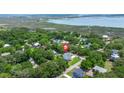 Aerial view of home in a neighborhood near the water with mature tree coverage at 1577 Periwinkle Dr, Mount Pleasant, SC 29466