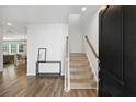 Warm and welcoming foyer with hardwood floors and stairway at 174 Red Bluff St, Summerville, SC 29483