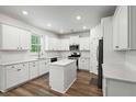 Modern kitchen featuring white cabinets, stainless steel appliances, and a center island at 174 Red Bluff St, Summerville, SC 29483