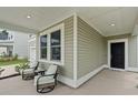Inviting porch area featuring comfortable seating, perfect for relaxing outdoors at 174 Red Bluff St, Summerville, SC 29483