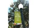 Street sign 'At the Heart of it All' attached to a lamp post in Summerville at 217 Seele St, Summerville, SC 29485