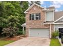 Beautiful home featuring brick, siding, a two-car garage, and professionally landscaped front yard at 2688 Jacana Ct, Mount Pleasant, SC 29466