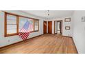 Spacious living room featuring beautiful hardwood floors and large windows at 2708 Mawood Ave, North Charleston, SC 29406
