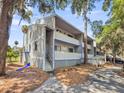 Exterior of home features stairs to balcony seating area and open-air space with patio furniture at 291 Sea Cloud Cir, Edisto Beach, SC 29438