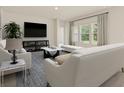 Comfortable living area with stylish furniture, lots of natural light, and open space at 424 Radiant Blue Way, Summerville, SC 29486