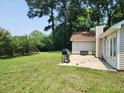 Lush backyard featuring a patio for grilling, ideal for outdoor living and gatherings at 514 Woodward Blvd, Summerville, SC 29483