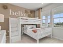 Cozy ' bedroom with bunk beds, a large window, and a fun, welcoming decor at 722 Meadowbrook Ln, Summerville, SC 29486