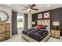 Stylish bedroom featuring modern decor, a ceiling fan, and ample natural light at 780 Meadowbrook Lane, Summerville, SC 29486