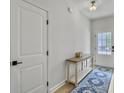 Inviting entryway with a stylish console table, elegant rug, and natural light at 953 Dusk Dr, Summerville, SC 29486
