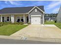 Attractive single story home with a well-manicured lawn and a one car garage at 953 Dusk Dr, Summerville, SC 29486