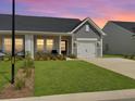 Charming single story home with a well-manicured lawn and a one car garage at 953 Dusk Dr, Summerville, SC 29486