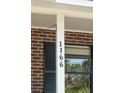 Close-up of the clearly visible house number, 1166, displayed on a white column at 1166 Julian Clark Rd, Charleston, SC 29412