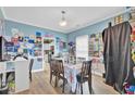 Inviting dining room with blue walls, wood floors, and decorative artwork displayed at 172 Cotillion Cresent Cres, Summerville, SC 29483