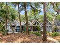 Inviting home exterior featuring a well-maintained lawn and lush landscaping at 2500 The Bent Twig, Seabrook Island, SC 29455