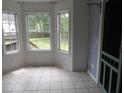 Bright sunroom with large windows offering a view of the backyard at 301 Archibald Dr, Goose Creek, SC 29445