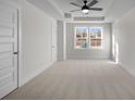 A bright bedroom featuring carpeted floors, a ceiling fan, and a window at 337 Bremerton Dr, Goose Creek, SC 29445