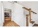 Staircase in the entryway leading to the upper level, with an open view of the kitchen at 3806 Grateful Rd, North Charleston, SC 29420
