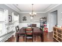 Dining room with hardwood floors, decorative lighting, and ample space for entertaining at 415 True North Trail, Summerville, SC 29486