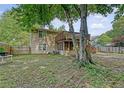 Backyard with an elevated deck, mature trees, a screened in porch, and an air conditioning unit at 4606 Moss Ct, North Charleston, SC 29420