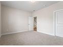 Bedroom with carpet and walk in closet with easy access to the staircase at 769 Maynard Ln, Summerville, SC 29486