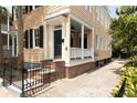 Home exterior showing brick foundation and front porch at 8 Pitt St # A, Charleston, SC 29401