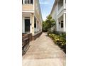 Home exterior showing brick foundation and gravel driveway at 8 Pitt St # A, Charleston, SC 29401