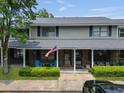 Exterior shot showcasing the townhome's entrance, American flag, and well-maintained landscaping at 925 Dills Bluff Rd # 34, Charleston, SC 29412