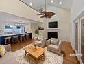 Cozy living room with hardwood floors, fireplace, ceiling fan and view of kitchen island at 932 Portabella Ln, Charleston, SC 29412