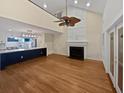 Bright, open living space featuring hardwood floors, fireplace, and view of the modern kitchen at 932 Portabella Ln, Charleston, SC 29412