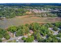 Marsh-front property with lush trees and natural surroundings in a serene setting, close to highway at 1102 N Shadow Dr, Mount Pleasant, SC 29464