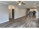 Spacious open concept living room boasts wood-look flooring and recessed lighting at 110A Dukes St, Saint George, SC 29477