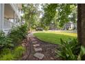 Serene view of the home's exterior and meticulously maintained front yard at 1116 Sea Island Crossing Ln, Mount Pleasant, SC 29464