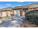 Charming brick home with a single-car garage and well-maintained landscaping at 127 Manning Ct, Summerville, SC 29485