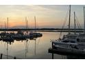 Picturesque view of sailboats and yachts docked at the marina during a serene sunset at 1948 Marsh Oak Ln, Seabrook Island, SC 29455