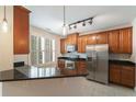 Well-equipped kitchen features stainless steel appliances, granite counters, and tile flooring at 2000 Belle Isle Ave # 204, Mount Pleasant, SC 29464